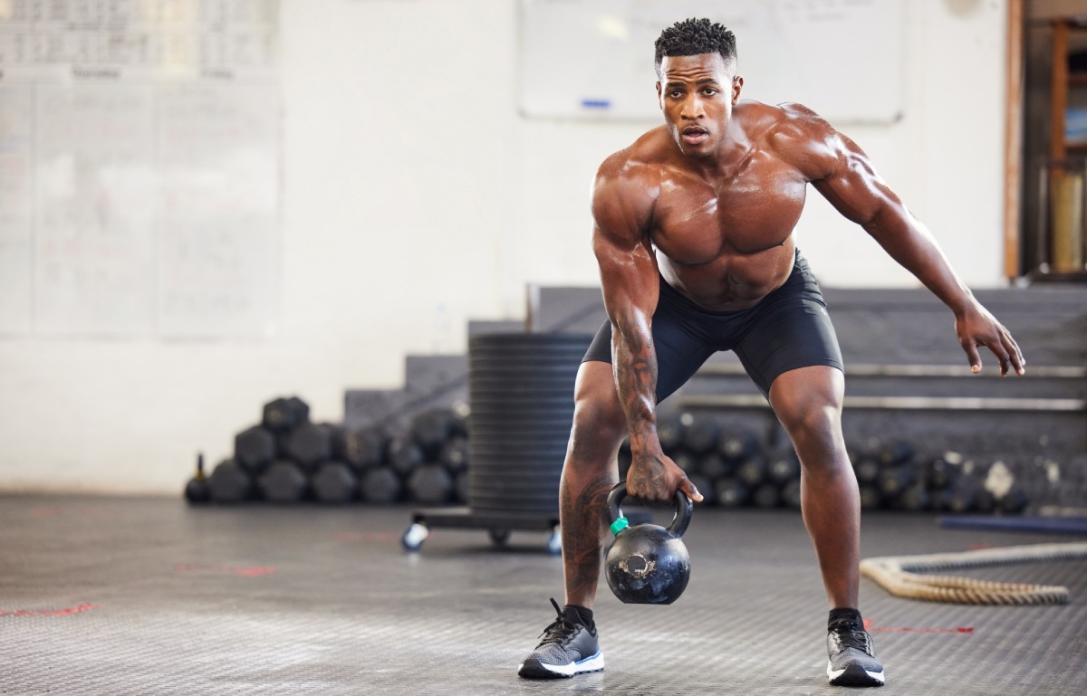 man, fitness and weightlifting with kettlebell for workout